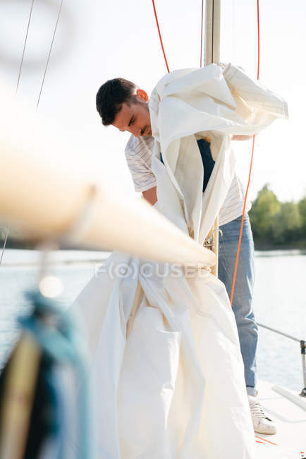 Man on sailing boat — Stock Photo