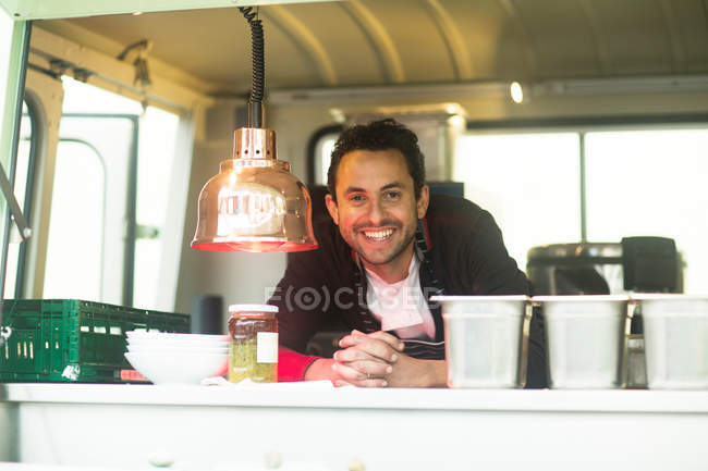 Small business owner at van food — Stock Photo