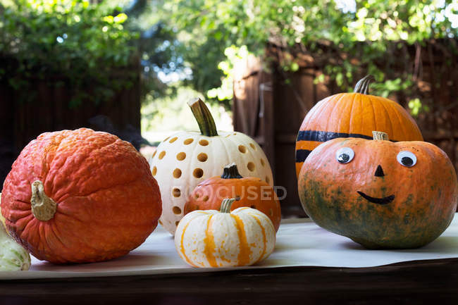 Smiley face and carved pumpkins — Stock Photo