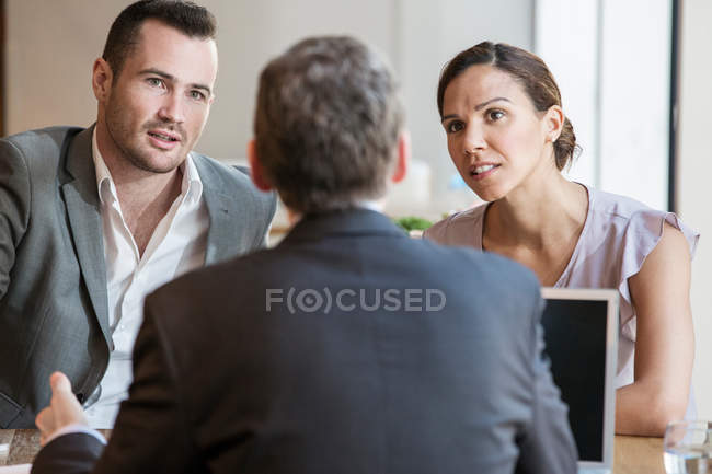 Businessmen and businesswoman working — Stock Photo