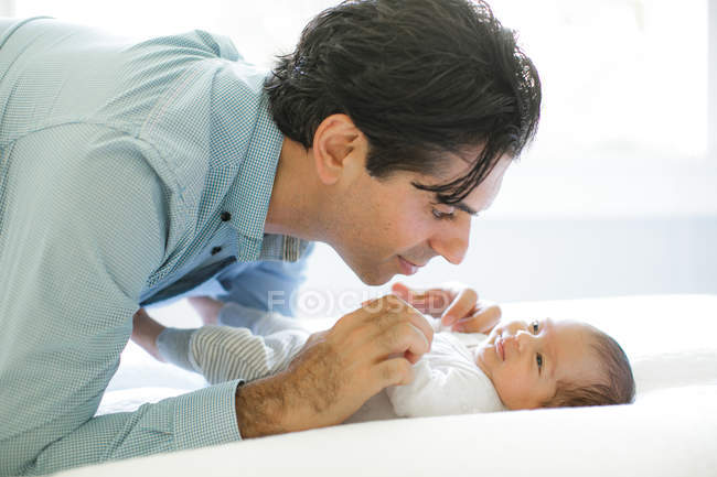 Father looking at newborn — Stock Photo