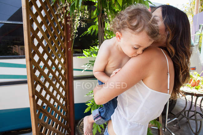 Boy kissing mother — Stock Photo