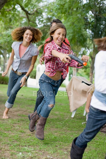 Children playing together on backyard — Stock Photo