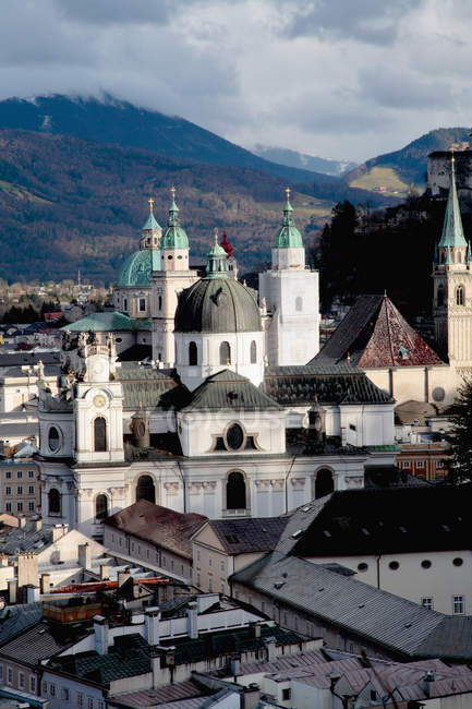 Salzburg cathedral overlooking rooftops — Stock Photo
