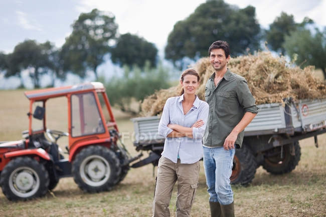 Farmers posing in front of truck — Stock Photo