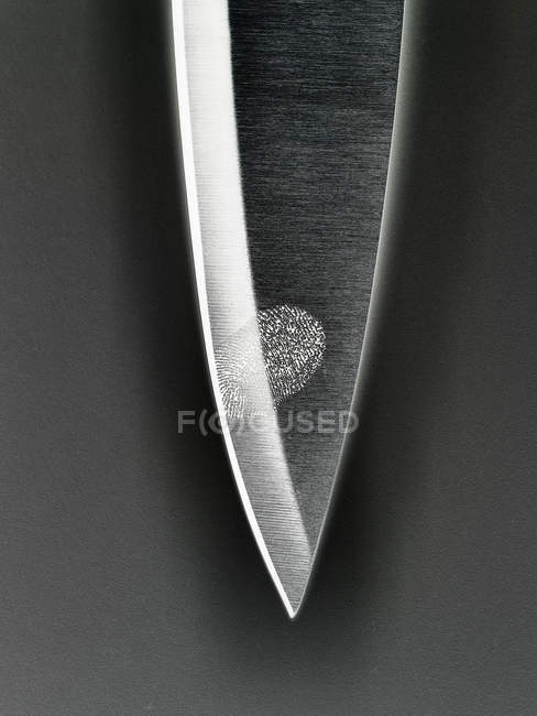 Fingerprint on knife blade — Stock Photo