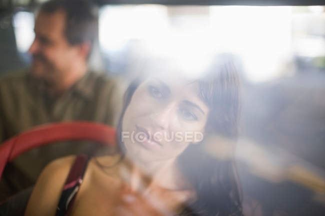 Woman looking through bus window — Stock Photo