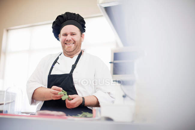 Chef at work in kitchen — Stock Photo