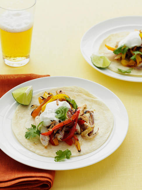 Chicken and peppers in tortilla — Stock Photo