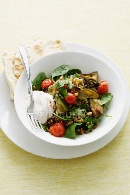 Salad with yogurt and bread — Stock Photo