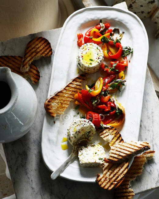 Ricotta with roasted peppers — Stock Photo