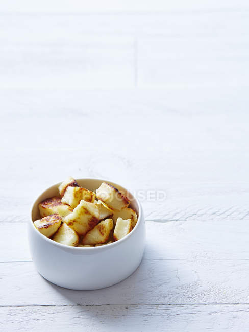 Haloumi croutons in bowl — Stock Photo