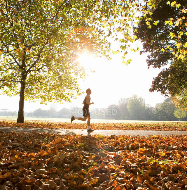 Young man running in park — Stock Photo
