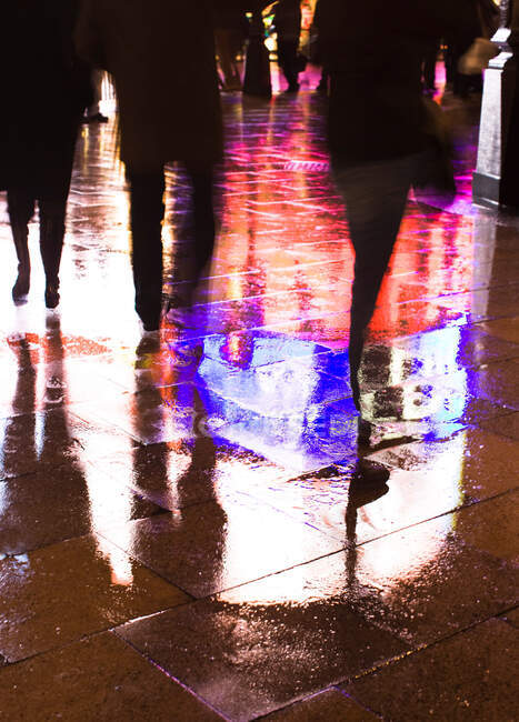 Shadow people on rainy street — Stock Photo