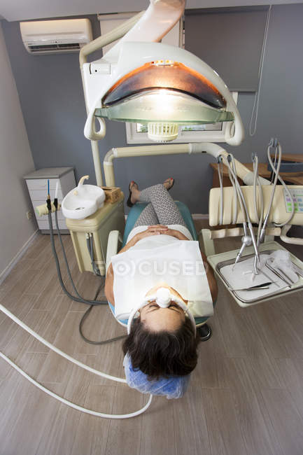 Female patient awaiting therapy in dental surgery — Stock Photo