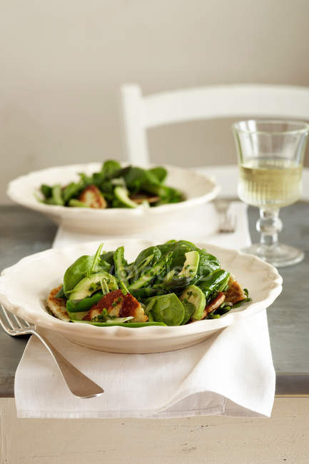 Baby spinach salad in bowls — Stock Photo