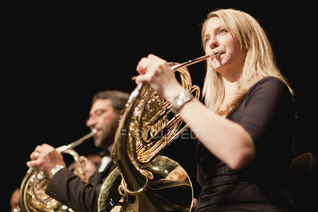 French horn players in orchestra — Stock Photo