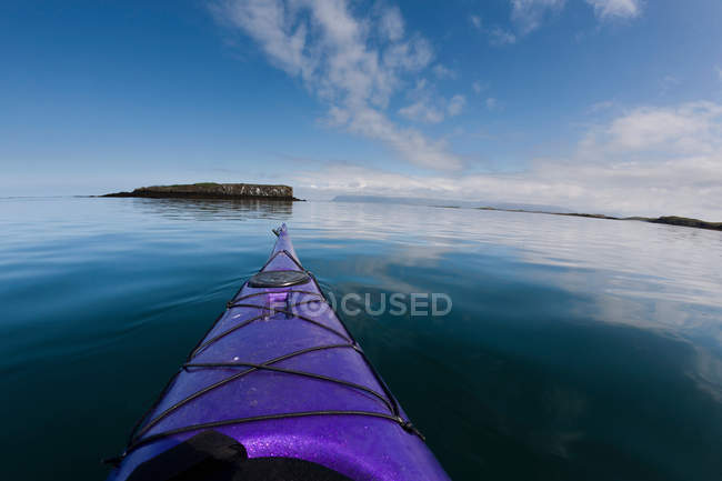 Nose of kayak on still lake — Stock Photo