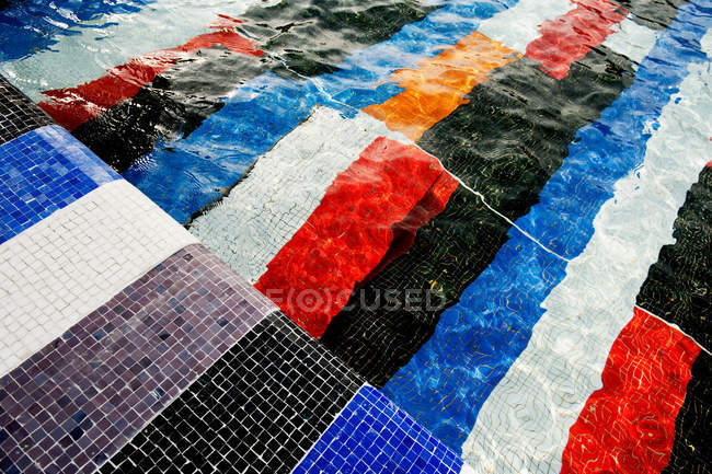 Colorful tiles in swimming pool — Stock Photo