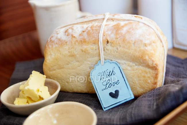 Loaf of bread with butter — Stock Photo