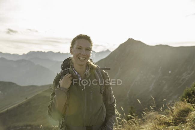 Portrait of mid adult female backpacker, Achensee, Tyrol, Austria — Stock Photo