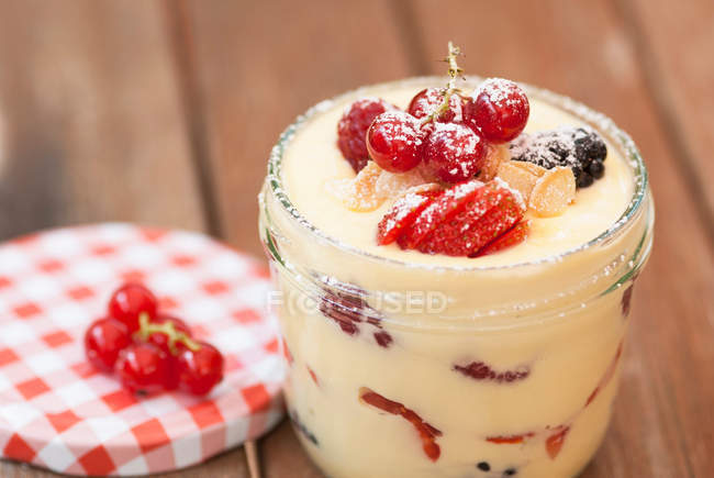 Custard with fruits in jar — Stock Photo