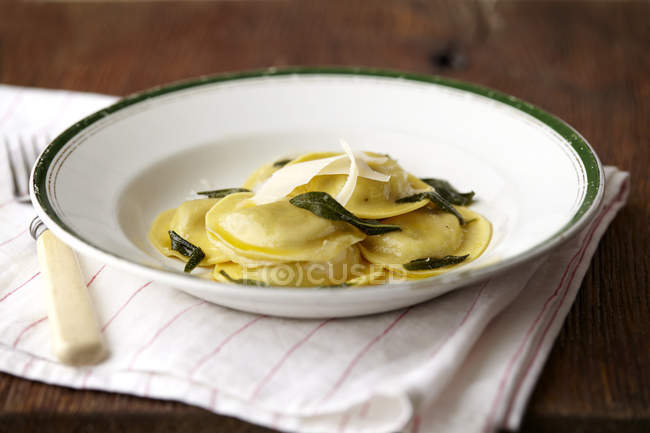 Ravioli with herbs in bowl — Stock Photo