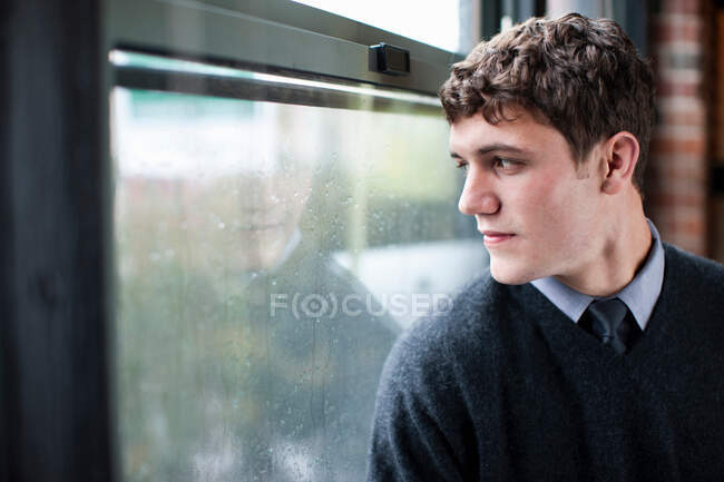 Businessman looking out window — Stock Photo