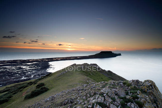Vista di Worms Head al tramonto, baia di Rhossili, Gower, Galles — Foto stock