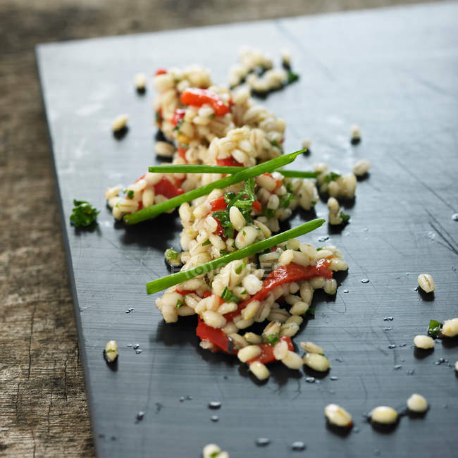 Close-up view of grain salad on board — Stock Photo
