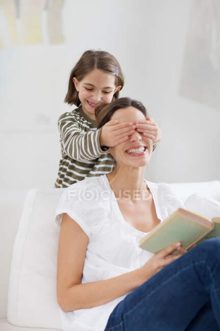 Young woman and little girl having fun — Stock Photo