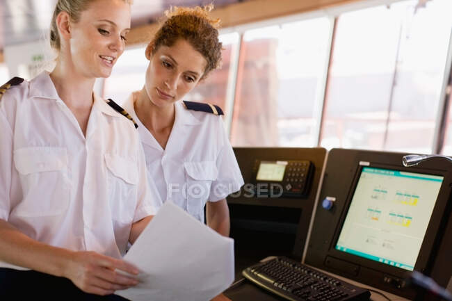 Female sailors doing their work — Stock Photo