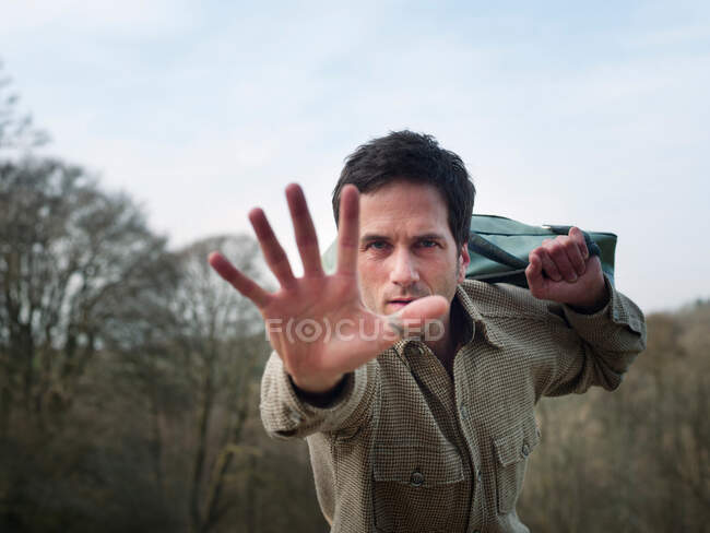 Man pushing out to camera — Stock Photo