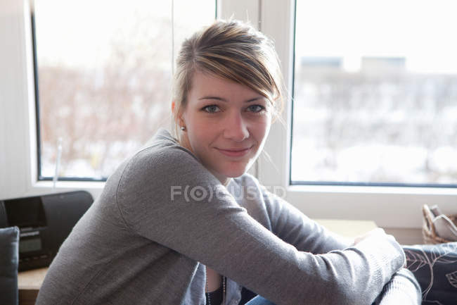 Portrait of young woman in her home — Stock Photo
