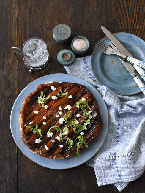 Carrot tarte tatin on plate with spices — Stock Photo