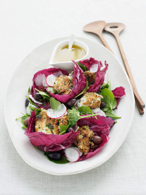Red leaf salad with anchovy sauce — Stock Photo