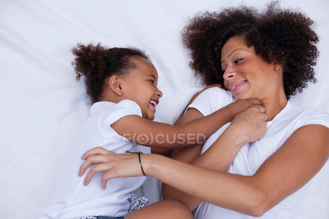 Mother and daughter playing together — Stock Photo