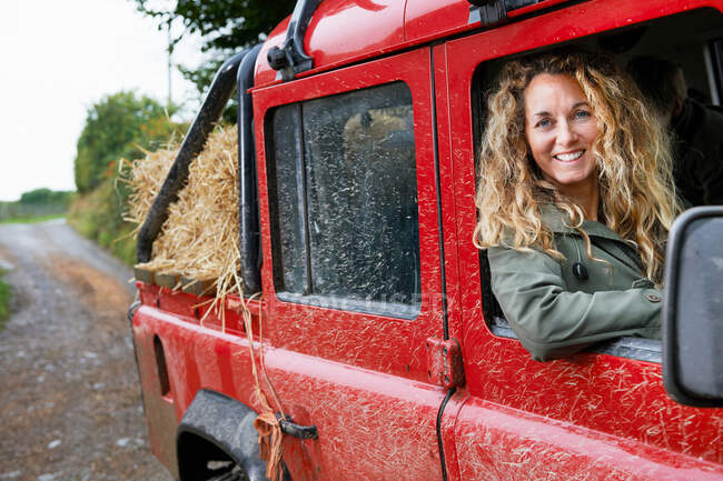 Mother driving 4x4 on the farm — Stock Photo