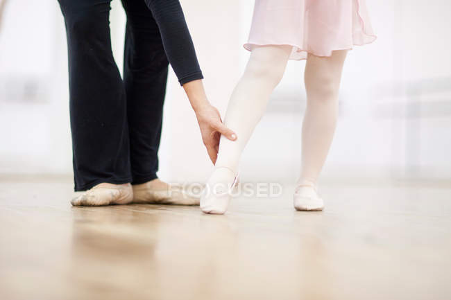 Ballerina and teacher practicing toe point — Stock Photo