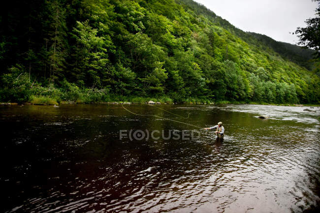 Fly fisherman in Margaree River, Cape Breton Island, Nova Scotia — Stock Photo