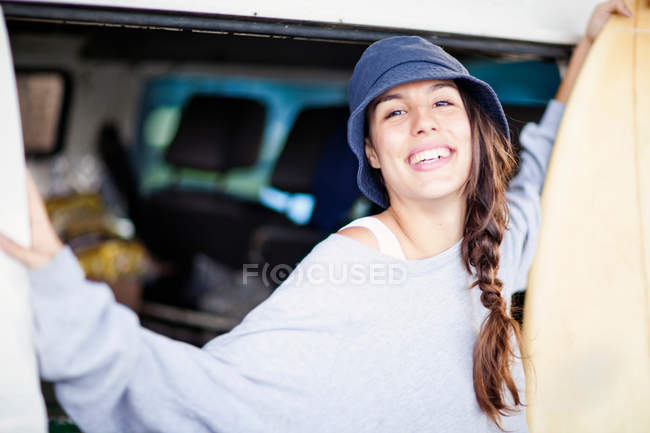 Portrait of young woman wearing beanie hat — Stock Photo