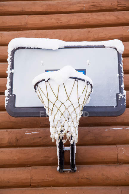 Snow filled basketball net — Stock Photo