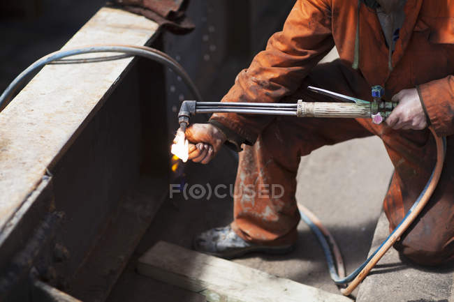 Welder lighting welding flame — Stock Photo