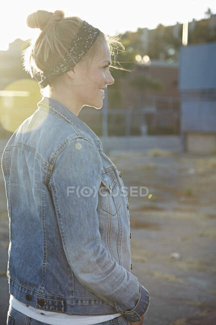 Rear view of woman standing in industrial area — Stock Photo