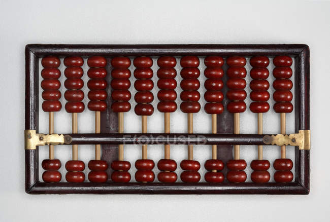 Traditional wooden brown abacus — Stock Photo
