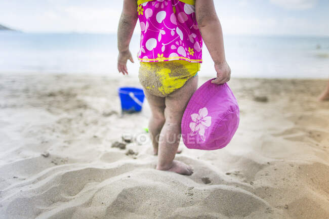Baby playing on sandy beach — Stock Photo