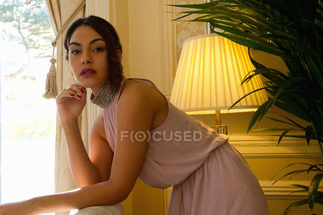 Portrait of attractive young woman in luxury hotel — Stock Photo