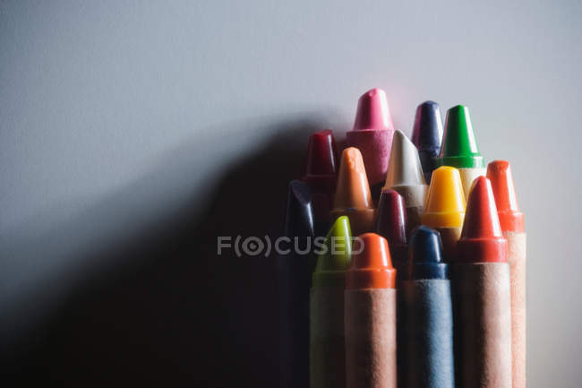 Closeup shot of stack of colourful wax crayons — Stock Photo