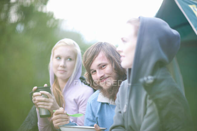 Portrait of young group of people in front of tent — Stock Photo