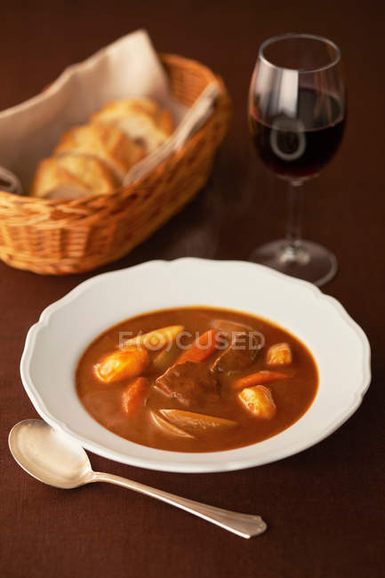 Soup in bowl with red wine — Stock Photo
